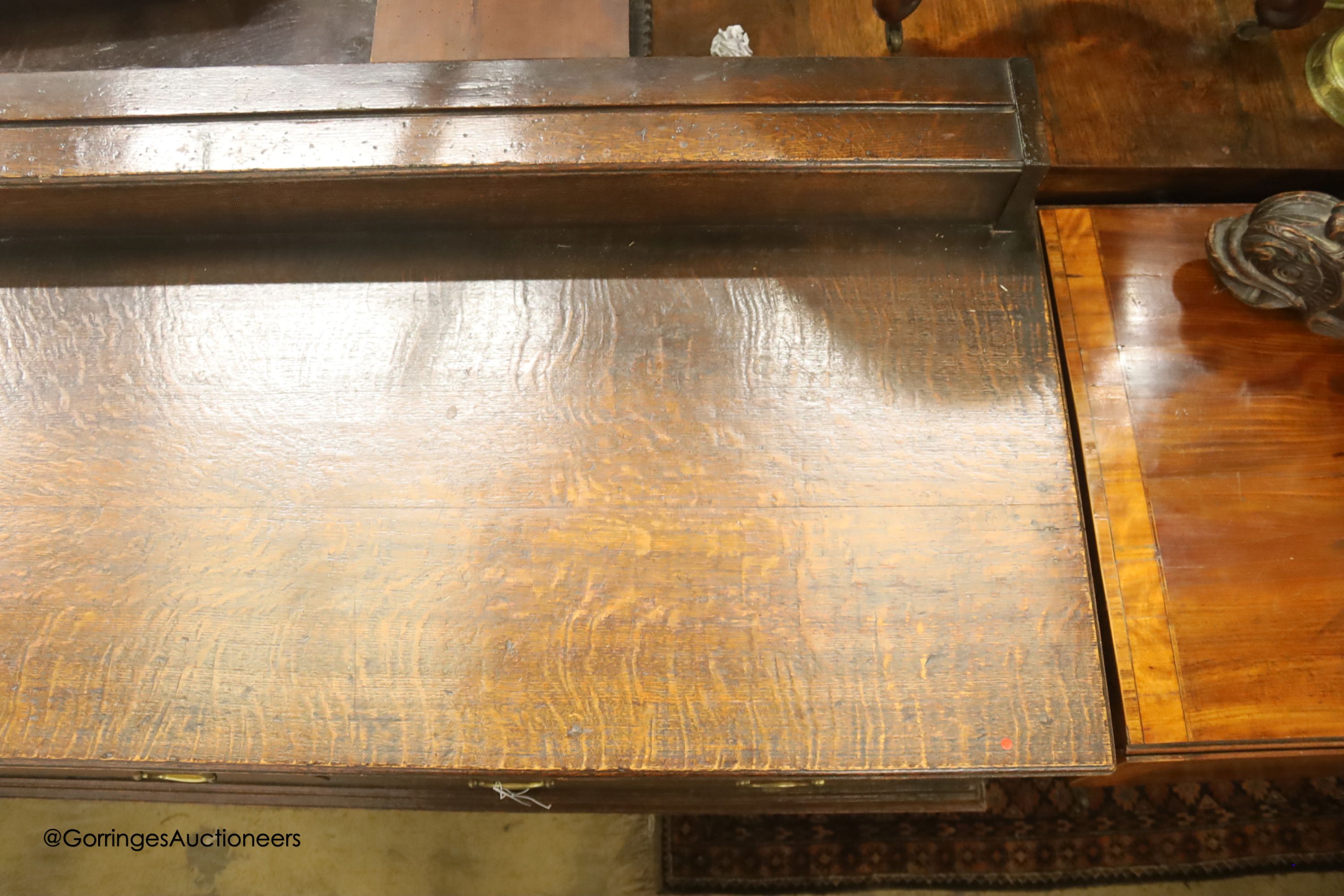 An 18th century oak low dresser, length 182cm, depth 58cm, height 90cm